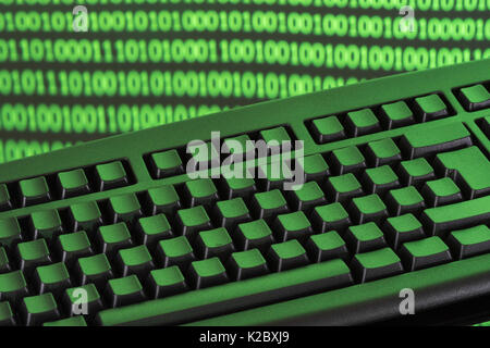 Black keyboard + binary code - for online transactions, cybercrime darkweb, hacking, cyberattack, data protection cyber-theft, 1s and 0s, hacktivism. Stock Photo