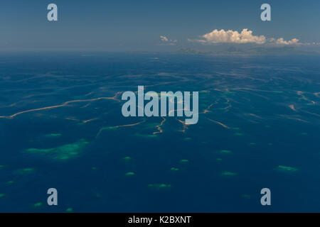 Aerial view of scattered small reefs with coral spawn on the water's surface.  Western Division, Fiji. December 2013. Stock Photo