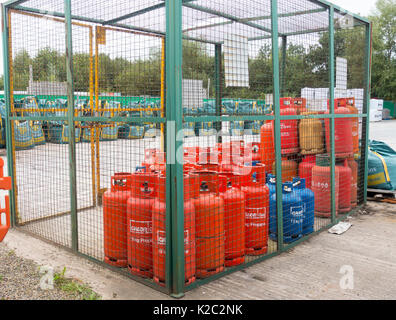 Gas bottles in a security cage on sale at the popular builders merchant Travis Perkins at the Winsford Site, Cheshire, UK Stock Photo