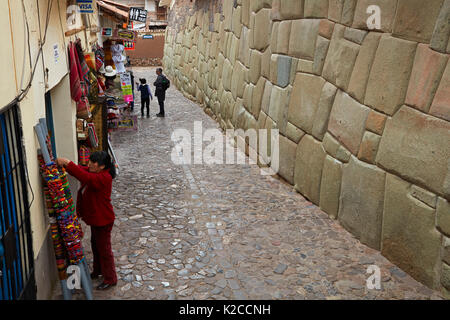 Historic Inca stonework and oturist shops, Inca Roca, Cusco, Peru, South America