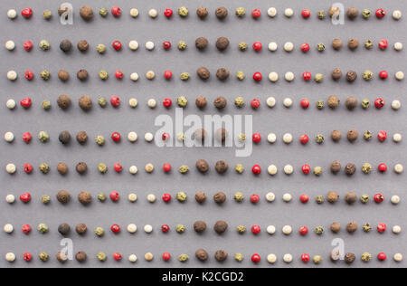 Mix of different peppers balls on a dark background. Stock Photo