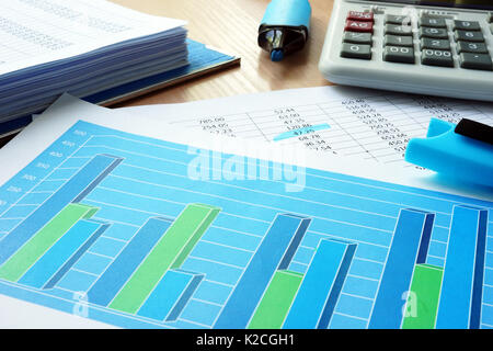 Business analytics with graphs and financial documents. Stock Photo