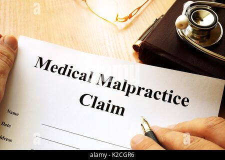 Medical Malpractice Claim on a table. Stock Photo