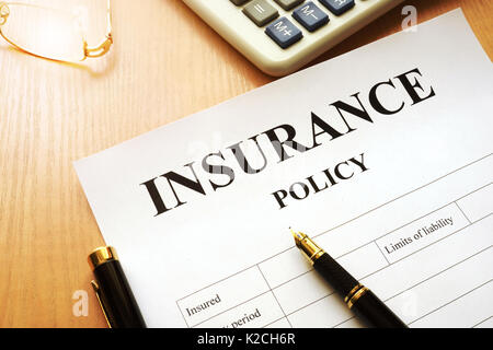 Insurance policy on a desk. Stock Photo