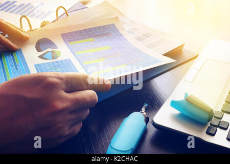 Man checking financial report. Work with business papers in office. Stock Photo