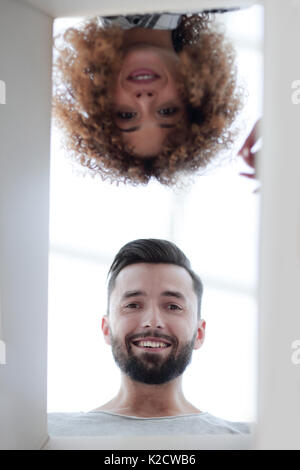 View from the bottom of the newlyweds looking inside the box. Stock Photo
