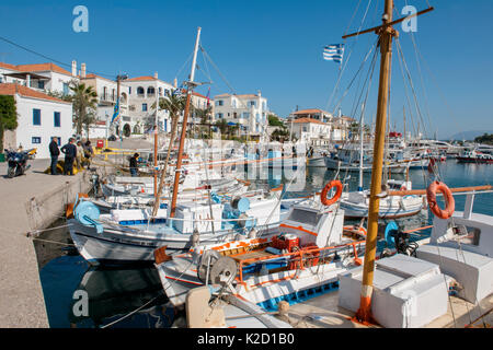Small Greek fishing boats called caique tied at the dock in harbour, Spetses Island, Aegean Sea, Mediterranean, Greece, April 2009 Stock Photo