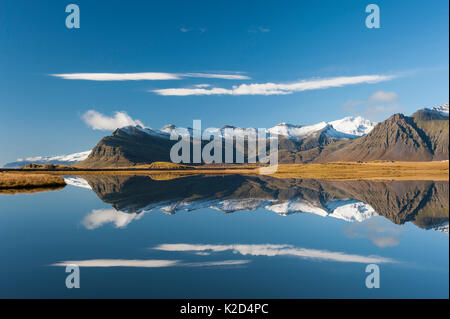 View towards Kalfatellsstadhur, with reflections in water, Iceland, October 2015. Stock Photo