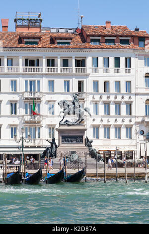The equestrian statue of Victor Emmanuel II on the Riva degli Schiavoni, Venice, Italy viewed from the lagoon with gondolas in the foreground. It was  Stock Photo