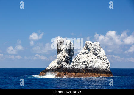 Roca Partida,  a small rock island covered in white bird guano  in the Revillagigedo Archipelago Biosphere Reserve, Socorro Islands, Western Mexico Stock Photo