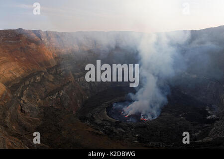 Steam rising from active lava lake in the crater of Nyiragongo Volcano, Virunga National Park, North Kivu Province, Democratic Republic of Congo, Africa Stock Photo