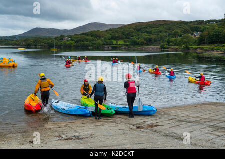 Women kayaking on Kenmare Bay, Ring of Kerry, Iveragh Peninsula, County Kerry, Ireland, Europe. September 2015. Stock Photo