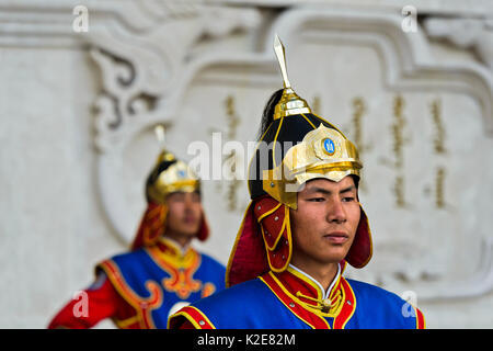 Guardian of the Mongolian armed forces in traditional uniforms in front of the Dschingis-Khan monument at the parliament Stock Photo