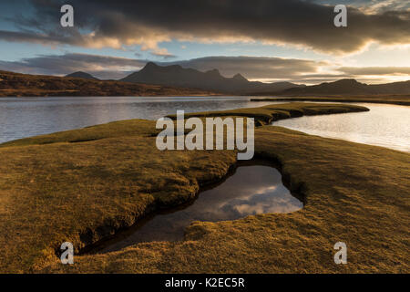 Saltmarsh exposed by low tide in evening light, Kyle of Tongue, Sutherland, Scotland, UK, November 2014. Stock Photo