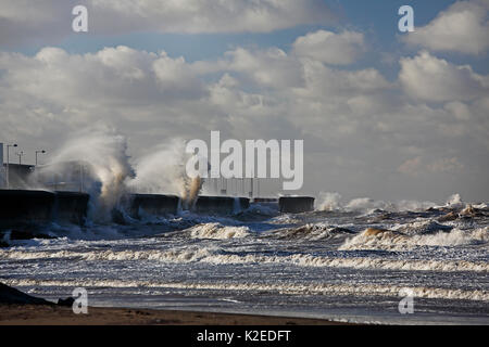 Stormy sea crashing against the sea wall at New Brighton Wirral, Merseyside, UK, January. Stock Photo