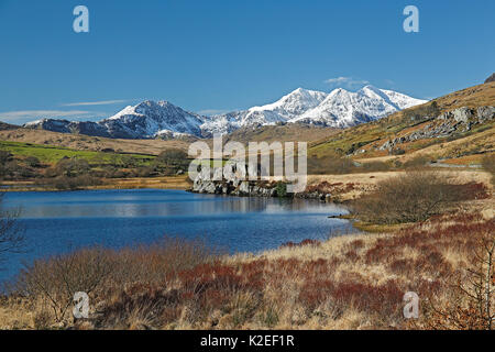 Snowdon Mountain range viewed from the west across Llynnau Mymbyr near Capel Curig, Snowdonia National Park, North Wales, UK, March. Stock Photo