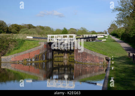 Flight of 16 locks up a steep hill on the Kennet and Avon canal, Caen Hill, Devizes, Wiltshire, UK, April 2014. Stock Photo