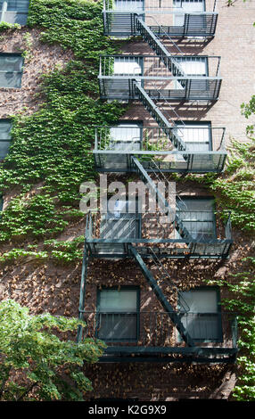 Building with Fire Escape on Charles Street in Greenwich Village, New York - USA Stock Photo