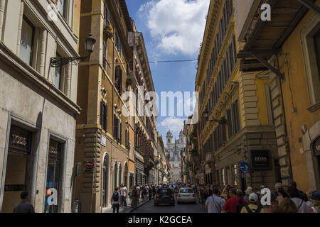 Tourists are walking around an old cozy street in Rome, Italy. Architecture and landmark of Rome. Postcard of Rome Stock Photo