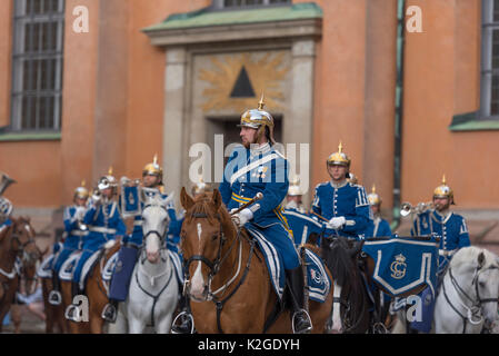 The life guard dragoons at the change of guards at the Royal castle in Stockholm, Sweden. They are all wearing historic uniforms. Stock Photo