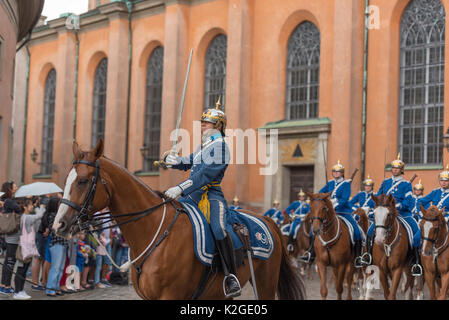 The life guard dragoons at the change of guards at the Royal castle in Stockholm, Sweden. They are all wearing historic uniforms. Stock Photo