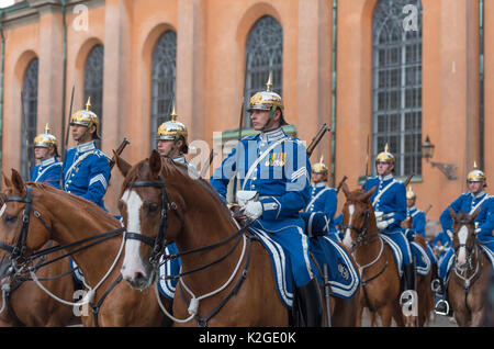 The life guard dragoons at the change of guards at the Royal castle in Stockholm, Sweden. They are all wearing historic uniforms. Stock Photo