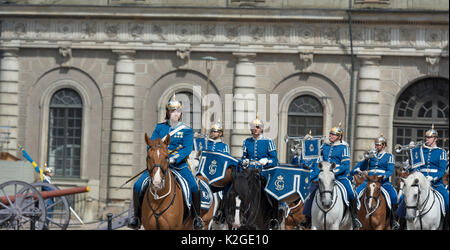 The life guard dragoons at the change of guards at the Royal castle in Stockholm, Sweden. They are all wearing historic uniforms. Stock Photo