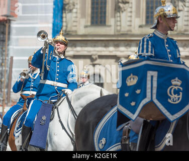 The life guard dragoons at the change of guards at the Royal castle in Stockholm, Sweden. They are all wearing historic uniforms. Stock Photo