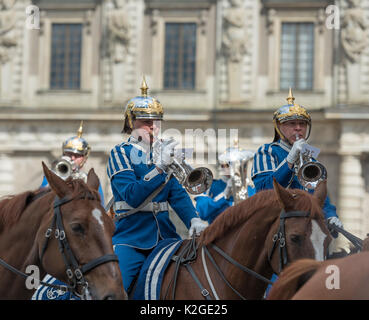 The life guard dragoons at the change of guards at the Royal castle in Stockholm, Sweden. They are all wearing historic uniforms. Stock Photo