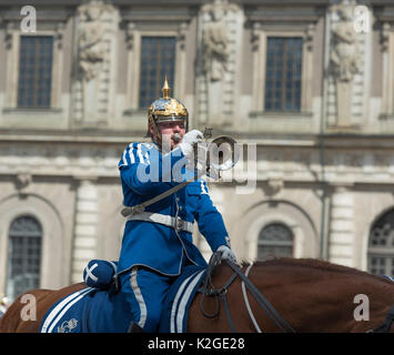 The life guard dragoons at the change of guards at the Royal castle in Stockholm, Sweden. They are all wearing historic uniforms. Stock Photo