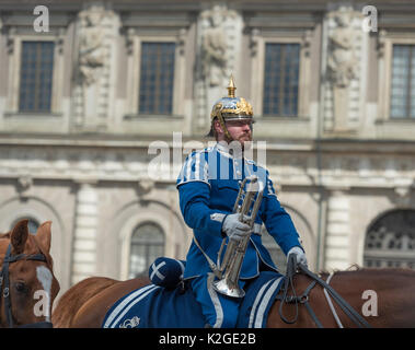 The life guard dragoons at the change of guards at the Royal castle in Stockholm, Sweden. They are all wearing historic uniforms. Stock Photo