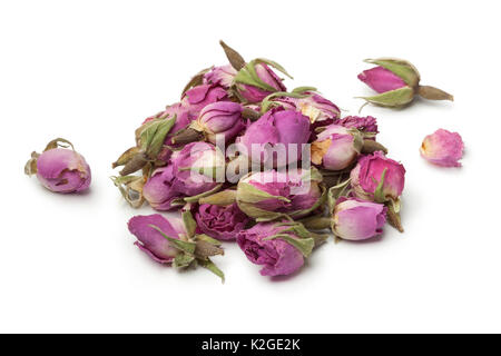 Heap of dried rose buds on white background Stock Photo