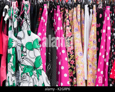 Vintage Style Dresses on a clothes rail at a vintage retro festival. UK Stock Photo