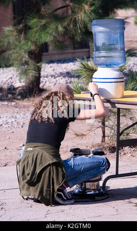 Staying hydrated at Corey Goode's Eclipse of Disclosure Conference, in the desert area of McCloud, California. Stock Photo