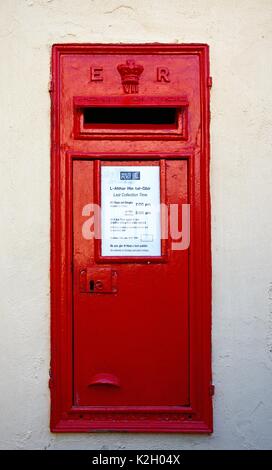 Traditional red British postbox in a wall, Mdina, Malta, Europe. Stock Photo