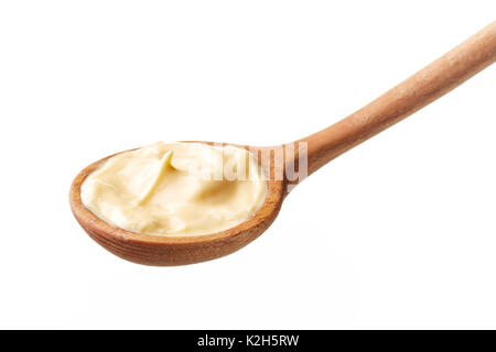 Mayonnaise in wooden spoon isolated on white background Stock Photo