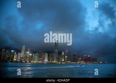 End of the day on the majestic Hong Kong skyline, seen from the Tsim Sha Tsui promenade. Stock Photo