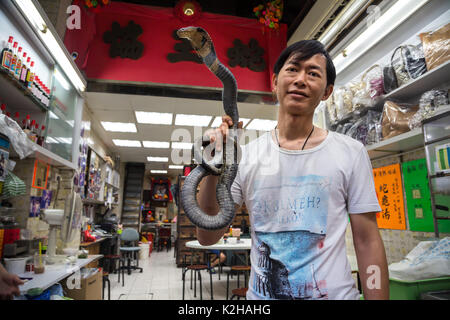 Snake soup seller in the streets of Kowloon, restaurant in Hong Kong Stock Photo