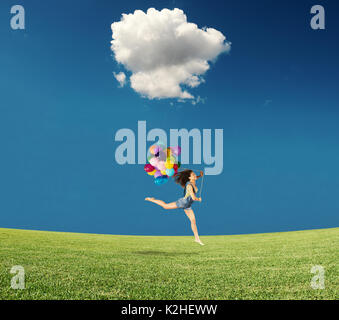 Jumping with balloons Stock Photo