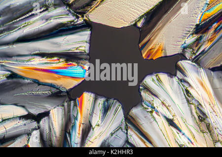 colorful microscopic shot of sugar micro crystals in polarized light Stock Photo