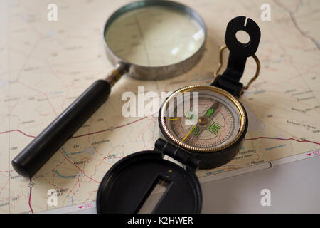 Compass and magnifying glass on a map Stock Photo