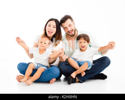 happy mixed race family sitting together Stock Photo