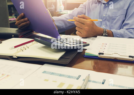 Business and finance concept of office working, Businessmen discussing analysis account balance chart, Vintage effect Stock Photo