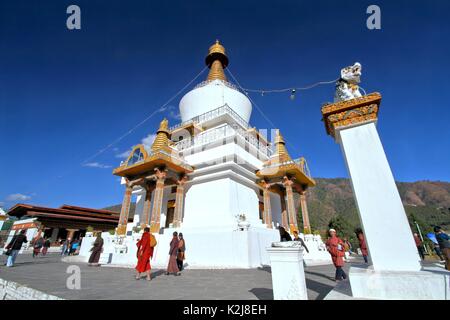 Thimphu, Bhutan - November 08, 2012: Bhutanese people in traditional dress with Tibetan prayer wheel walking around the National Memorial Chorten pray Stock Photo