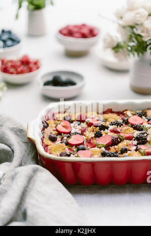 A goat cheese & berry bread pudding is photographed from the front after it was baked. Stock Photo