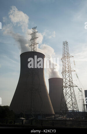 Tihange, Belgium. 28th Aug, 2017. Two cooling towers of the nuclear power plant issuing steam by the Mass river in Tihange, Belgium, 28 August 2017. The power plant is made up of 3 blocks with pressurized water reactors. Iodine tablets will be distributed for free in the Aachen region starting 01 September. The tablets are supposed to protect the population from thyroid cancer in the case of a reactor accident in the Belgian town of Tihange. Photo: Rainer Jensen/dpa/Alamy Live News Stock Photo