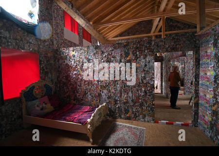 Cologne, Germany. 31st Aug, 2017. View of the interior of the 'Save The World' Hotel by performance artist HA Schult at the Rhine river in Cologne, Germany, 31 August 2017. The sculpture is an accessible house made of and decorated with trash. Photo: Henning Kaiser/dpa/Alamy Live News Stock Photo