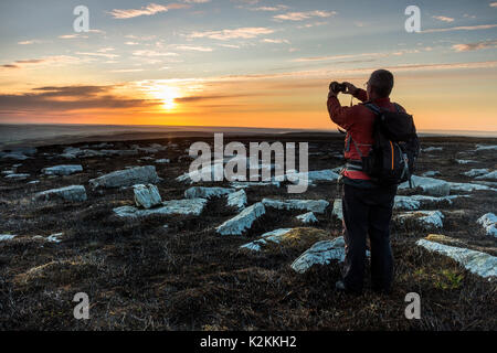 Harnisha Hill, Weardale, County Durham UK. 1st September 2017. UK Weather. This hiker headed out early to enjoy a beautiful sunrise over the North Pennines on the first day of the Metrological Autumn. Credit: David Forster/Alamy Live News. Stock Photo