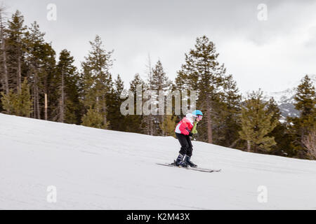 Skier going down the hill Stock Photo