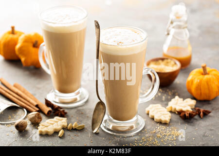 Pumpkin spice latte in tall mugs with cinnamon, nutmeg and cardamom Stock Photo